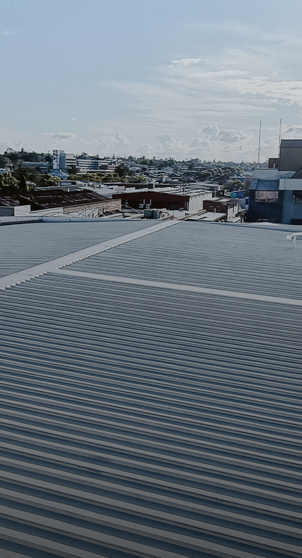 A commercial roof undergoing restoration